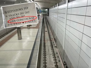 A platform in the new LIRR portion of Grand Central (inset shows a sign indicating that Long Island Rail Road trains will finally come to Grand Central). Photos: Dave Colon