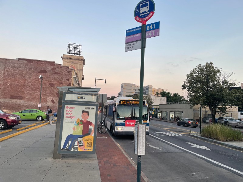 A B41 bus pulls up to the curb on Empire Boulevard and Flatbush Avenue at dusk. Photo: Dave Colon