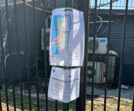 A notice and map tied to a fence informed greenway users about the closure in May. Photo: Allegra N. Legrande