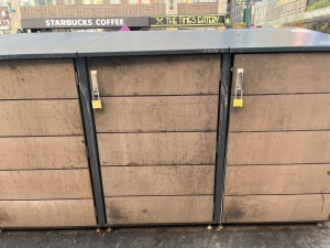 The Times Square Alliance's trash enclosure at Eighth Avenue and 43rd Street has only been out there since the end of April. It's tough out there in 'The Deuce.' Photo: Eve Kessler