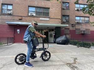 Nathaniel Hill, a resident of public housing in the Bronx, won't be able to charge his bike in his apartment under a new rule. Photo: Noah Martz