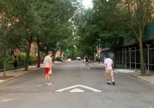We spotted these kids playing catch in the street in Jackson Heights, thanks to cars being banished — the very kind of scene that people claim they're nostalgic for ("We used to play stickball in the street!") yet freak out when they finally see it. Photo: Gersh Kuntzman