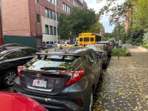 Parents triple parked at dismissal, creating a traffic jam in front of the Amber Charter School (at left) in Inwood on Oct. 25. Photo: Eve Kessler