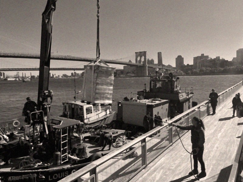 Is this 2023 or 1923? Beer arrives at Pier 17 by boat.