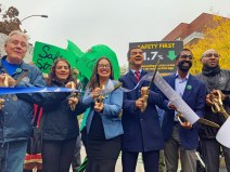 Ydanis Rodriguez any Jackson Heights pols cut a ceremonial ribbon on Paseo Park on Monday. Photo: Julianne Cuba