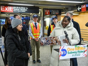 The MTA's Acting Chief Customer Officer Shanifah Rieara presents Bronx resident Sasha Salazar with a gift for being the one billionth subway rider of 2022. Photo: Marc A. Hermann/MTA