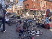 Cyclists stage a "die-in" on Friday morning on Ninth Street, 10 days after 37-year-old Sarah Schick was killed on the cooridor. Photo: Julianne Cuba