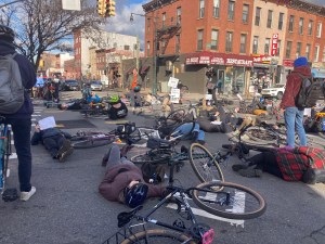 Cyclists stage a "die-in" on Friday morning on Ninth Street, 10 days after 37-year-old Sarah Schick was killed on the cooridor. Photo: Julianne Cuba