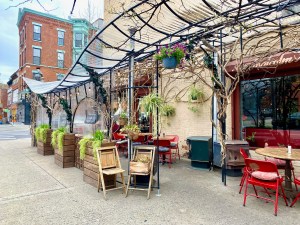 Chez Oskar's outdoor dining structures beautify Malcolm X Boulevard in Brooklyn. Photo: Shannon Greer