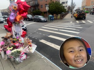 On Thursday, DOT workers (background) were on the scene of the death of 7-year-old Dolma Naadhun to make improvements to the intersection. Photo: Gersh Kuntzman