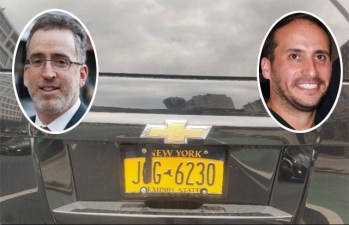 Adam White (left) was arrested by NYPD after Sholem Klein called them about White's attempt to undeface Klein's plate.