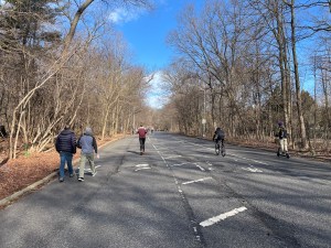 Joggers, walkers, cyclists and scooter riders all using Prospect Park's east loop, which is due for new asphalt and striping. Photo: Dave Colon