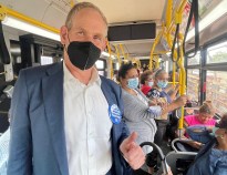 Lieber, seen on a bus last year giving a thumbs up for the cameras, gave a thumbs down to all-door boarding Wednesday. Photo: Tim Minton/MTA