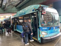 Riders board the Q70 LaGuardia Link in Jackson Heights. Photo: Kevin Duggan