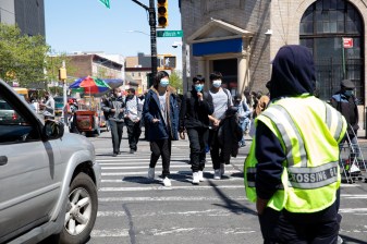 Kids are endangered at intersections like Church and Flatbush avenues, close to Erasmus Hall High School, but the city is cutting crossing guard positions. Photo: Bess Adler