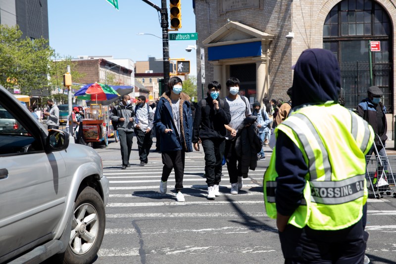 Kids are endangered at intersections like Church and Flatbush avenues, close to Erasmus Hall High School, but the city is cutting crossing guard positions. Photo: Bess Adler