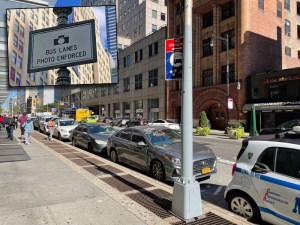 A row of cars parked in a No Standing zone leading to a bus stop on Jay Street. Soon, the owners of all these cars will get tickets from enforcement cameras. Photo: Dave Colon