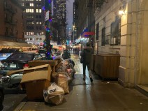 Penned in: New Yorkers routinely have to navigate cramped sidewalks thanks to garbage taking up space. File photo: Kevin Duggan