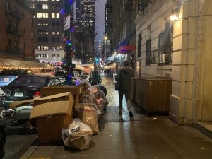 Penned in: New Yorkers routinely have to navigate cramped sidewalks thanks to garbage taking up space. File photo: Kevin Duggan