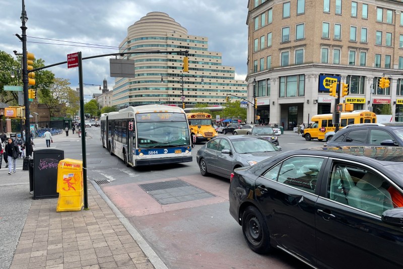 The DOT is hoping that moving Fordham Road's bus lane off the curb will mean fewer scenes like this BX9 caught in traffic. Photo: Dave Colon