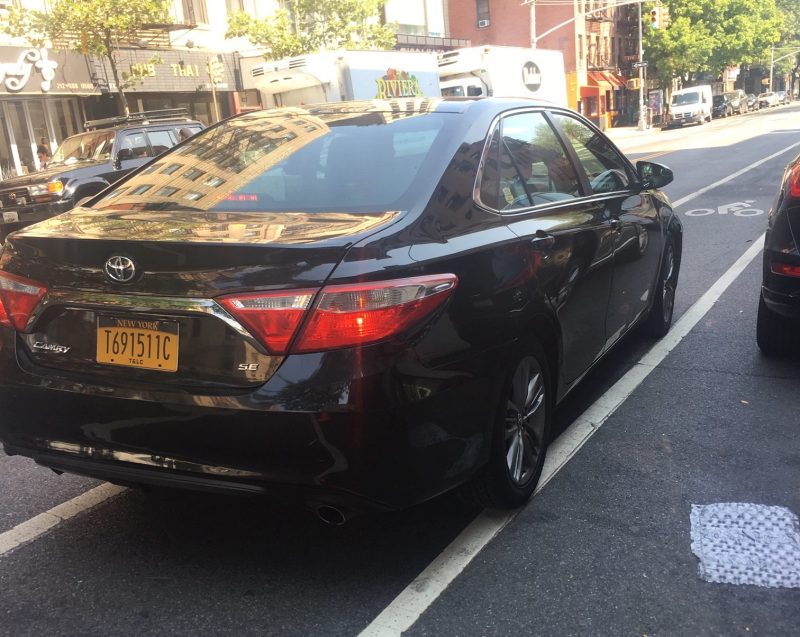 This Uber driver — pictured in a bike lane in 2019 — racked up 30 tickets in three years, including multiple moving violations. Photo: Vivian Lipson
